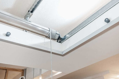 Close-up of the Auxx Attic Lift mechanism showcasing the motorized garage storage lift system for easy access.