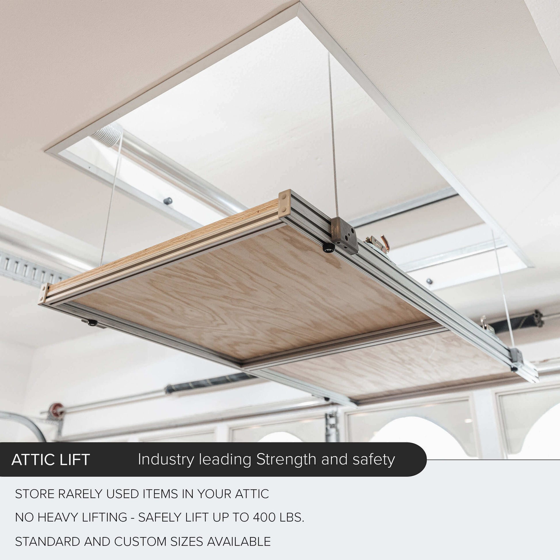 Auxx Attic Lift system showcasing a motorized garage storage lift for easy attic access and safety.