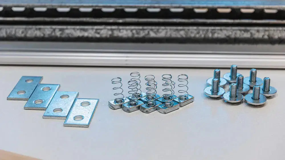 Auxx Lift platform rotation hardware kit components, including plates, springs, and bolts for installation.