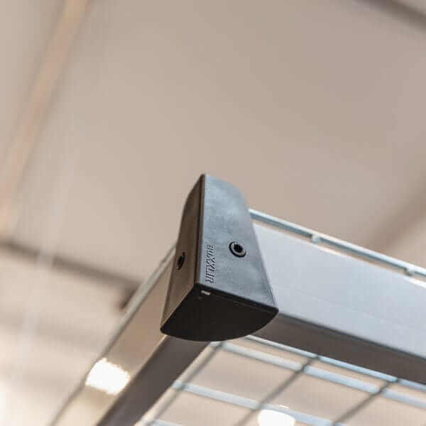 Close-up of Auxx Lift's platform corner support, part of the motorized garage storage lift system.