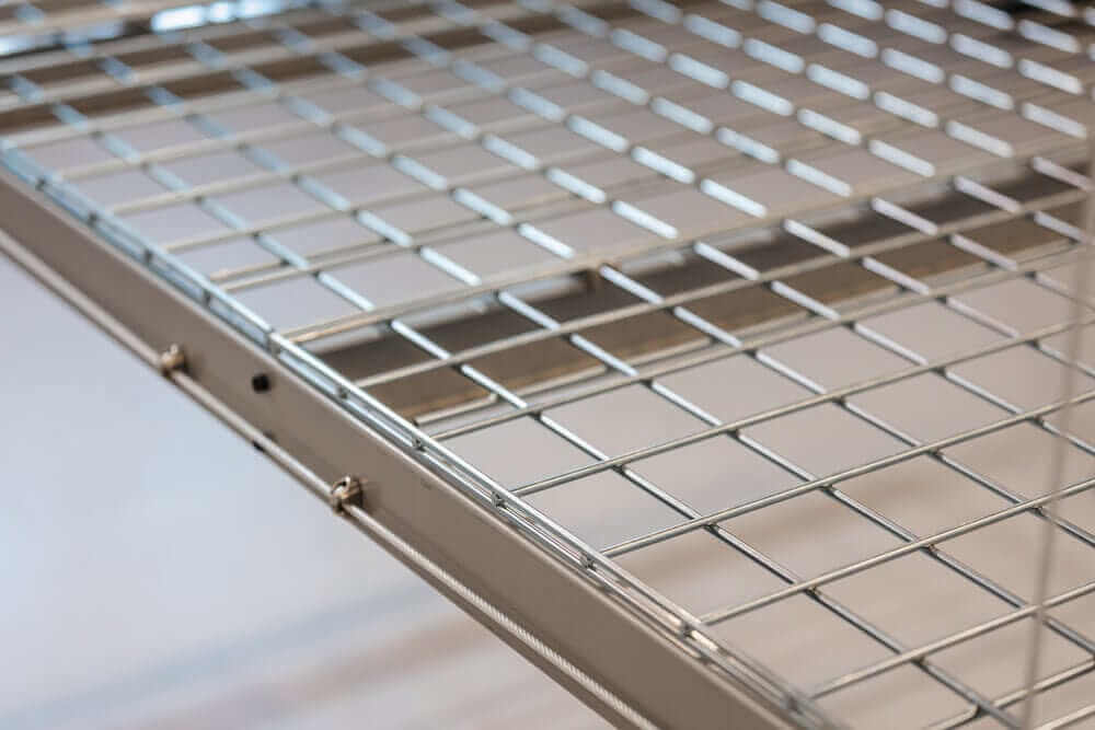 Close-up of the sturdy metal grid platform of the Auxx Lift, showcasing durable design for motorized garage storage.