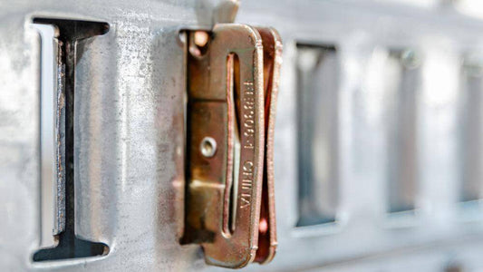 Auxx Lift webbing guide Snap-In Anchor features flat slot for webbing, ensuring it doesn't twist in load securing systems. 