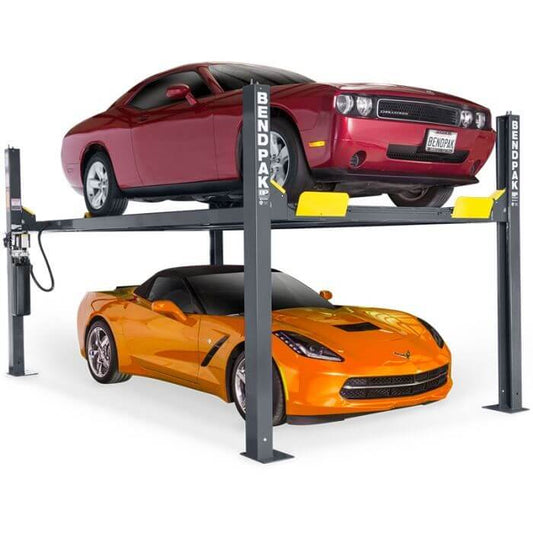 BendPak HD-9 four-post car lift with a red muscle car and orange sports car lifted securely. 