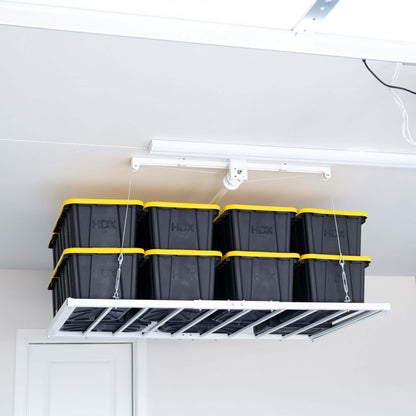 Ceiling Sam Retractable 4x6 Garage Ceiling Storage Lift with storage bins overhead.