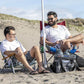 Two men relax on the beach with the Cool Boss Coolee CL-240, enjoying a cool breeze and refreshments.