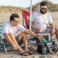 Two men enjoying the beach with the Cool Boss CL-240 Coolee air cooler, refreshing drinks and relaxation.