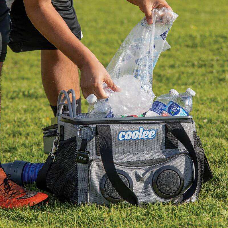 Person packing ice and drinks into a Cool Boss Coolee CL-240 portable air cooler and ice chest.