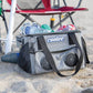 Cool Boss CL-240 Coolee: portable air cooler, ice-chest, and Bluetooth player on the beach with drinks.