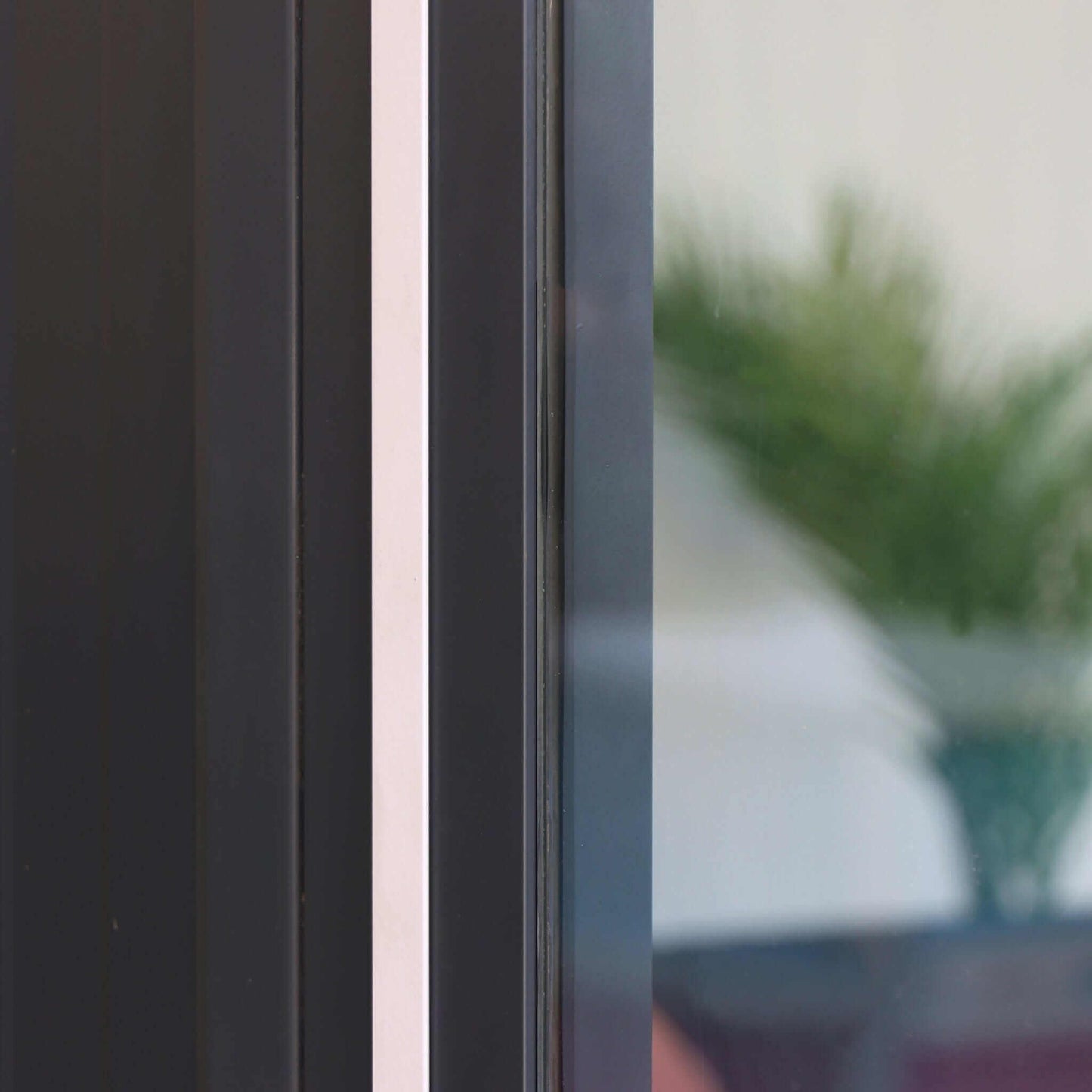 Close-up of the Duramax 10x10 Glass Garden Room door frame showcasing elegant design and insulation features.