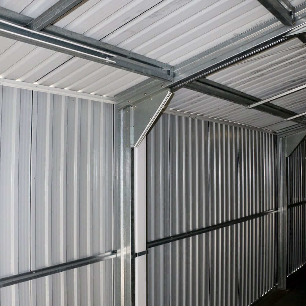 Interior view of Duramax 12x20 Imperial Metal Garage showing metal paneling and framework.