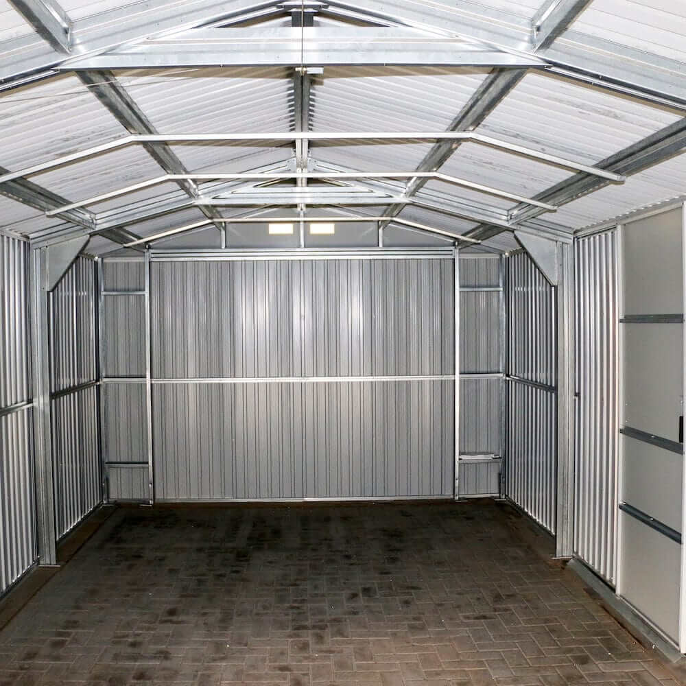 Interior view of a Duramax 12x20 Imperial Metal Garage in light gray with off-white accents, showcasing strong steel construction.