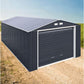 Duramax 12x26 Imperial Metal Garage in dark gray with white trim, showcasing durability and design on a gravel path.