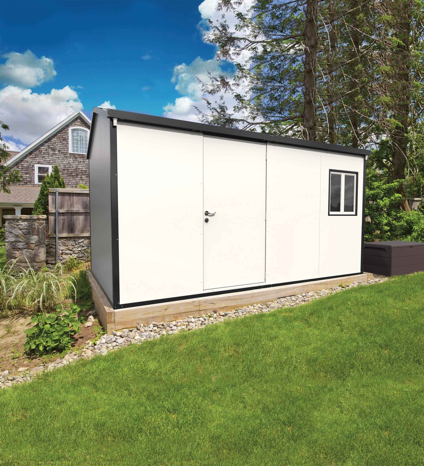 Duramax 13x10 insulated building with gable roof in backyard setting.