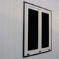 Double window frame on a wall, featuring a sleek design and white finish.