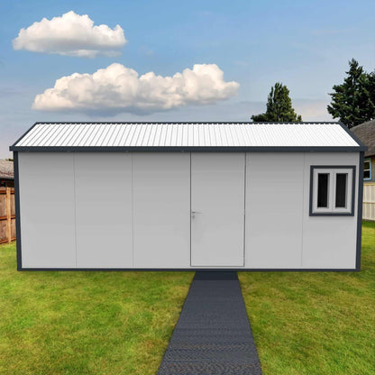 Duramax 19x10 gable roof insulated building with a door and window in a grassy yard.