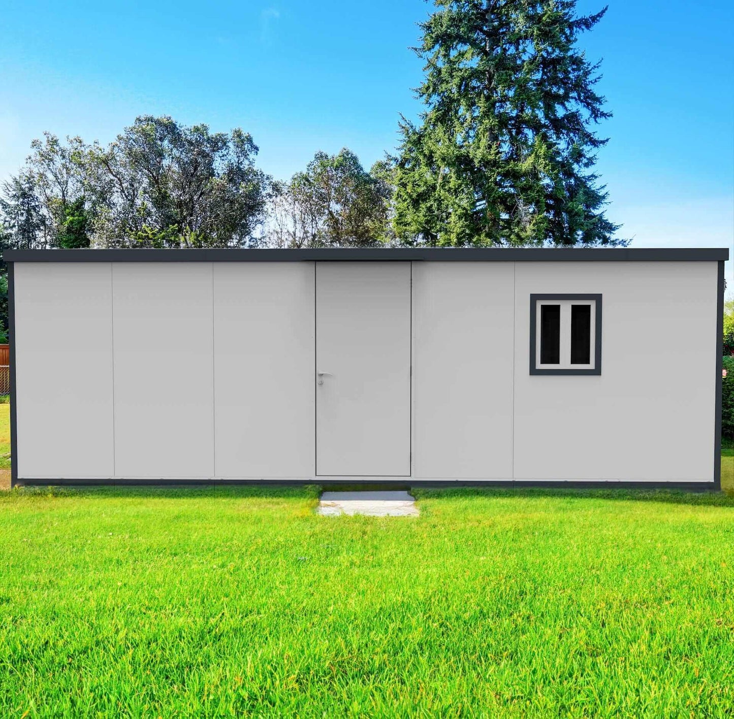 Duramax 22x10 insulated building with flat roof, featuring a door and window, set in a green lawn.