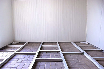 Interior view of Duramax insulated building showing sturdy frame and floor foundation.