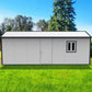 Duramax 22x10 gable roof insulated building in a grassy area with trees, ideal for storage or workspace.