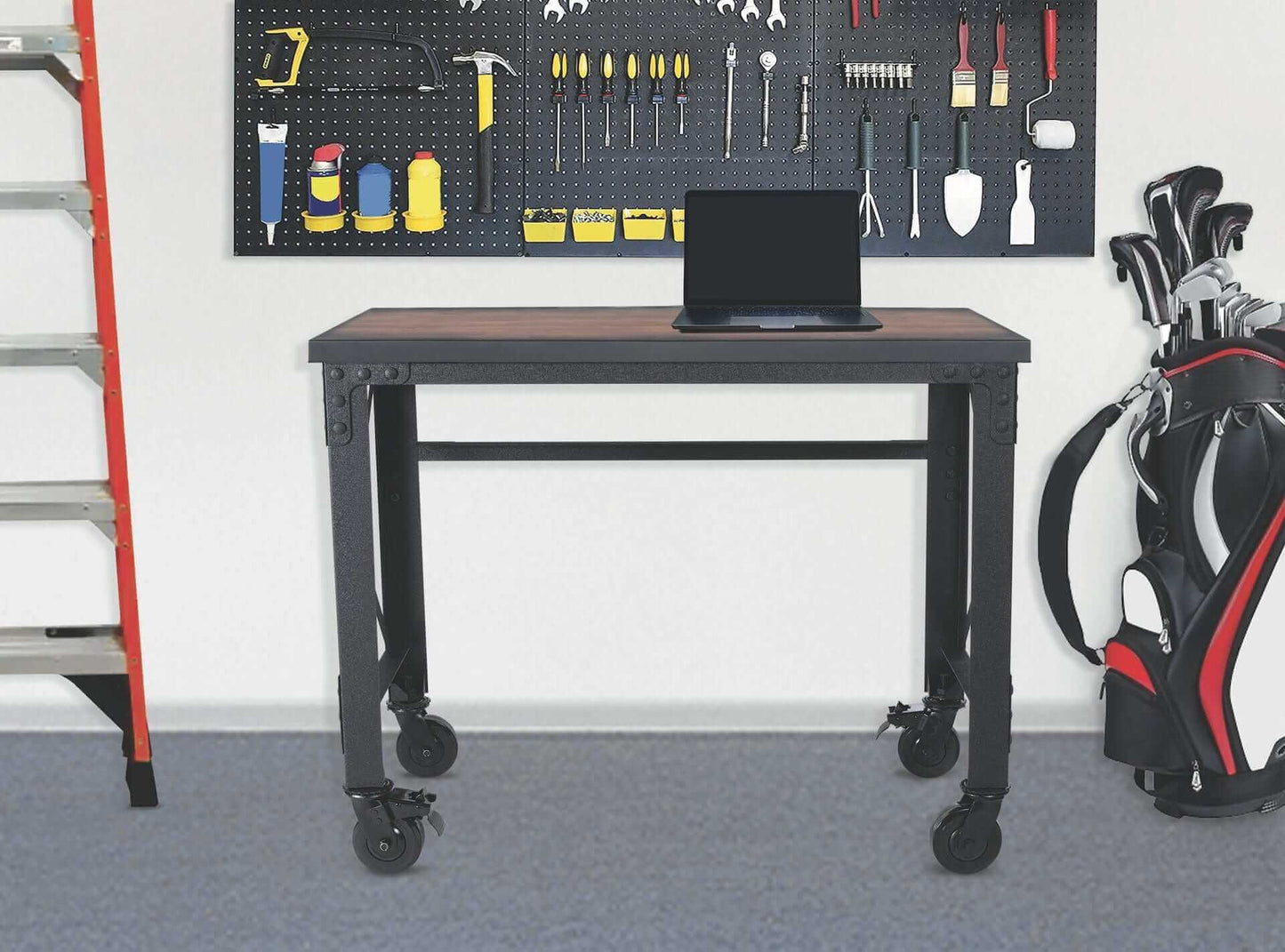 Duramax 46 In x 24 In Rolling Industrial Worktable with laptop, black metal frame, and caster wheels in a workspace setting.