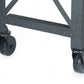 Close-up of the sturdy caster wheels on a Duramax industrial rolling worktable for easy mobility.