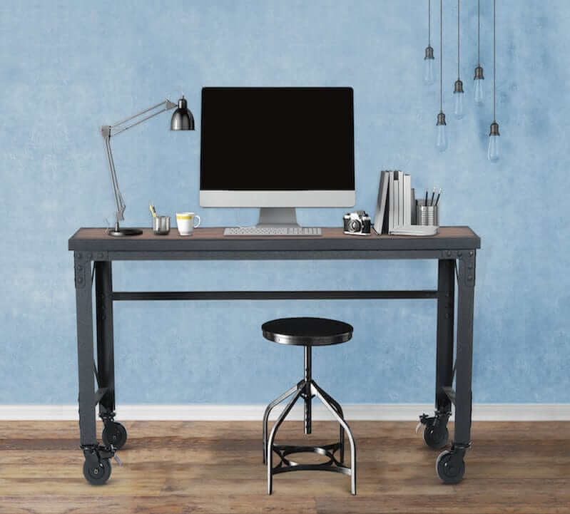 Duramax 62x24 inch rolling industrial worktable with a modern workspace setup, including a computer and desk lamp.