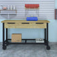 Duramax mobile workbench with 3 drawers on wheels, set against a garage wall with tools and storage.