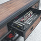 Drawer of a rolling workbench filled with organized tools and socket sets, showcasing storage efficiency.