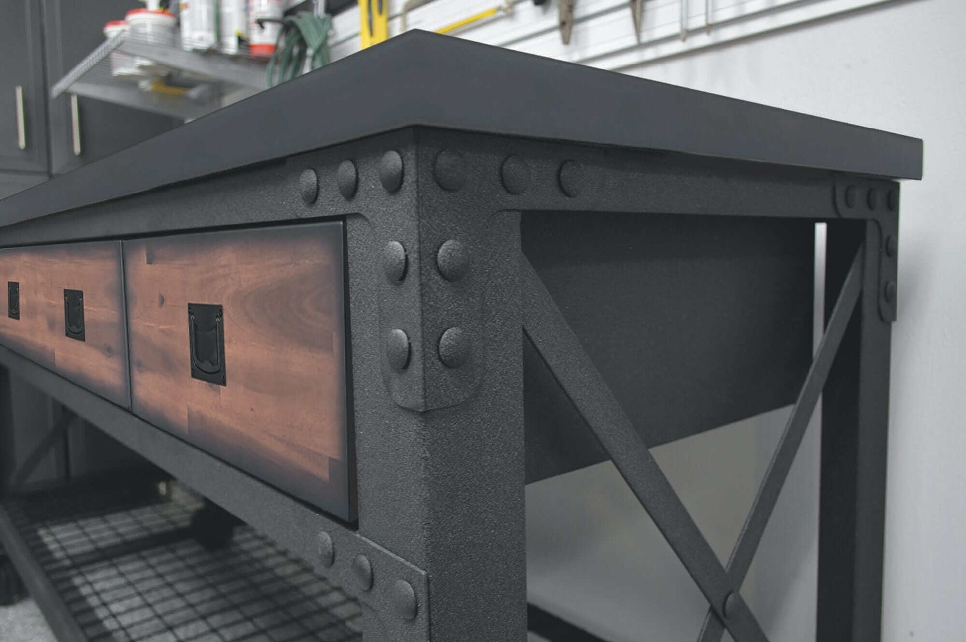 Close-up of Duramax 72-inch rolling industrial workbench showcasing steel frame and wooden drawers.