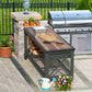 Outdoor industrial workbench with wooden top beside a grill and potted plants in a patio setting.