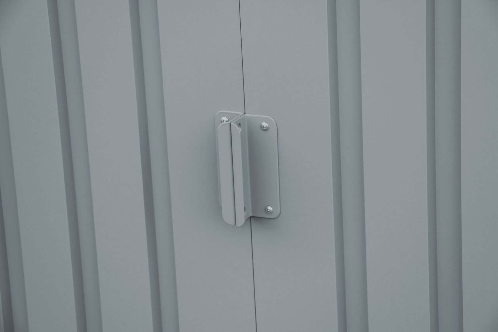 Close-up of the door handle on a Duramax 8x6 metal shed, showcasing its robust design.