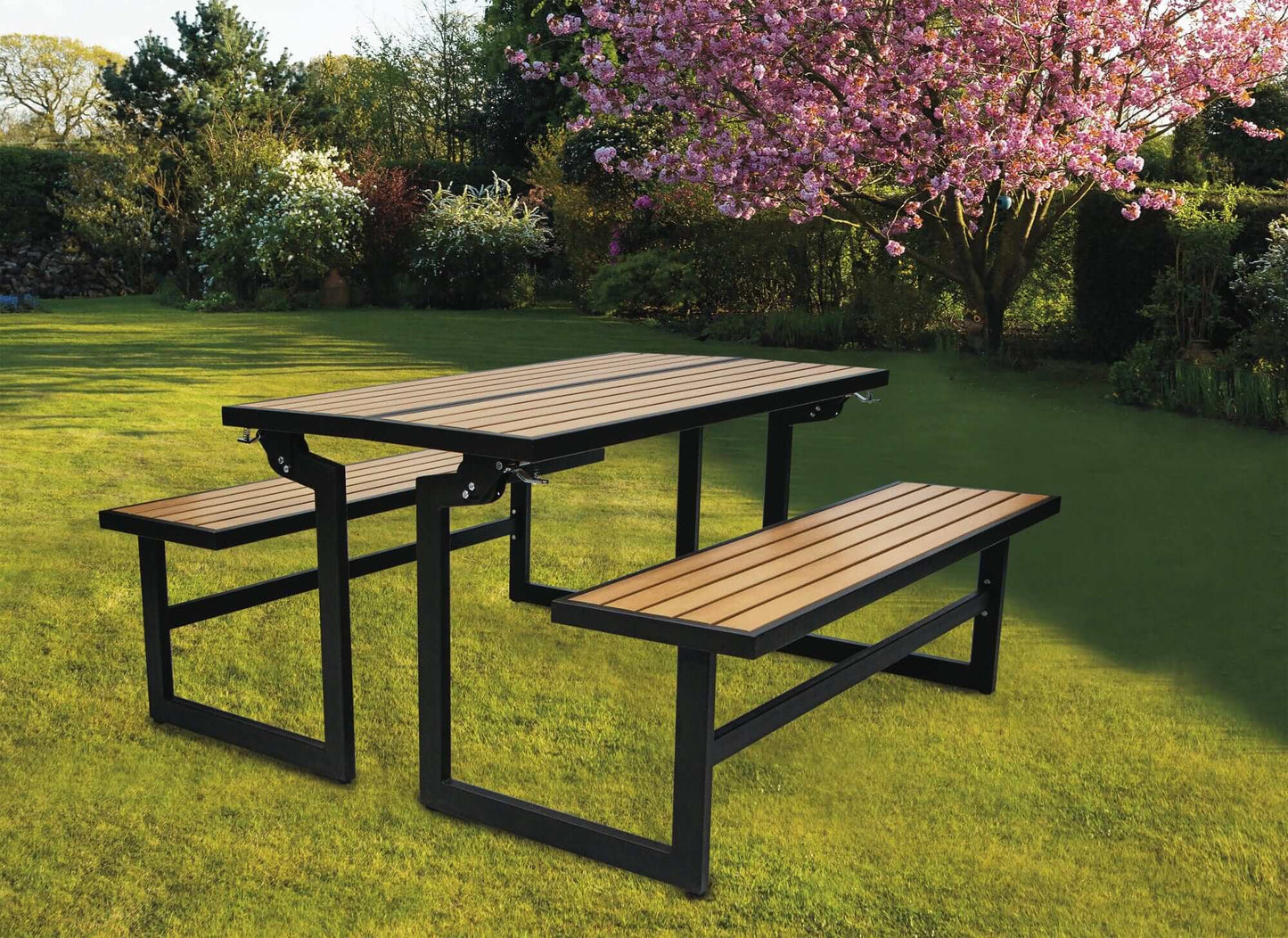 Duramax Ashton Convertible Table Bench 68070 in a garden setting under blossoming trees.