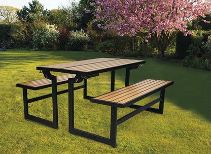 Duramax Ashton Convertible Table Bench 68070 in a garden setting under blossoming trees.