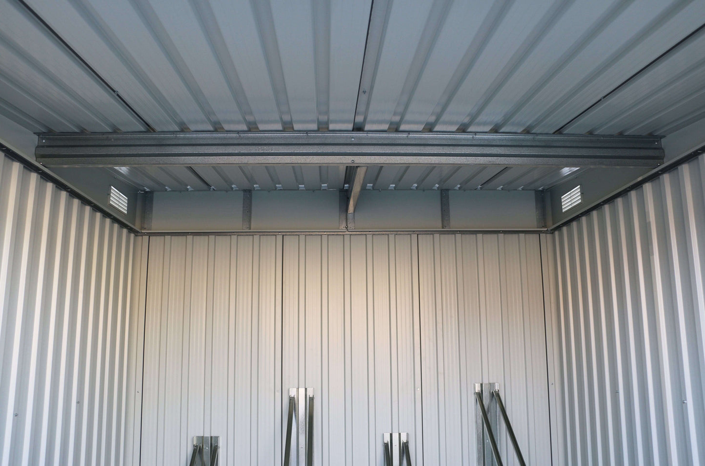 Interior view of the Duramax Bicycle Storage Shed showing metal structure and ventilation features.