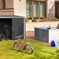 Duramax Bicycle Storage Shed 73051 in backyard with bikes, storage container, and pool in the background.