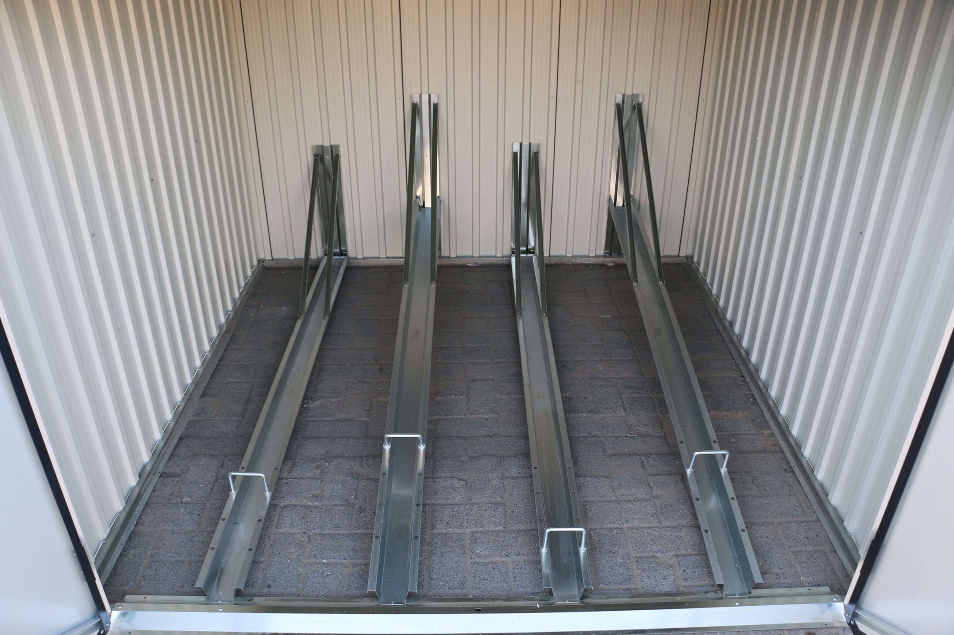 Interior view of Duramax Bicycle Storage Shed 73051 showing bike storage rail system for secure bike placement.