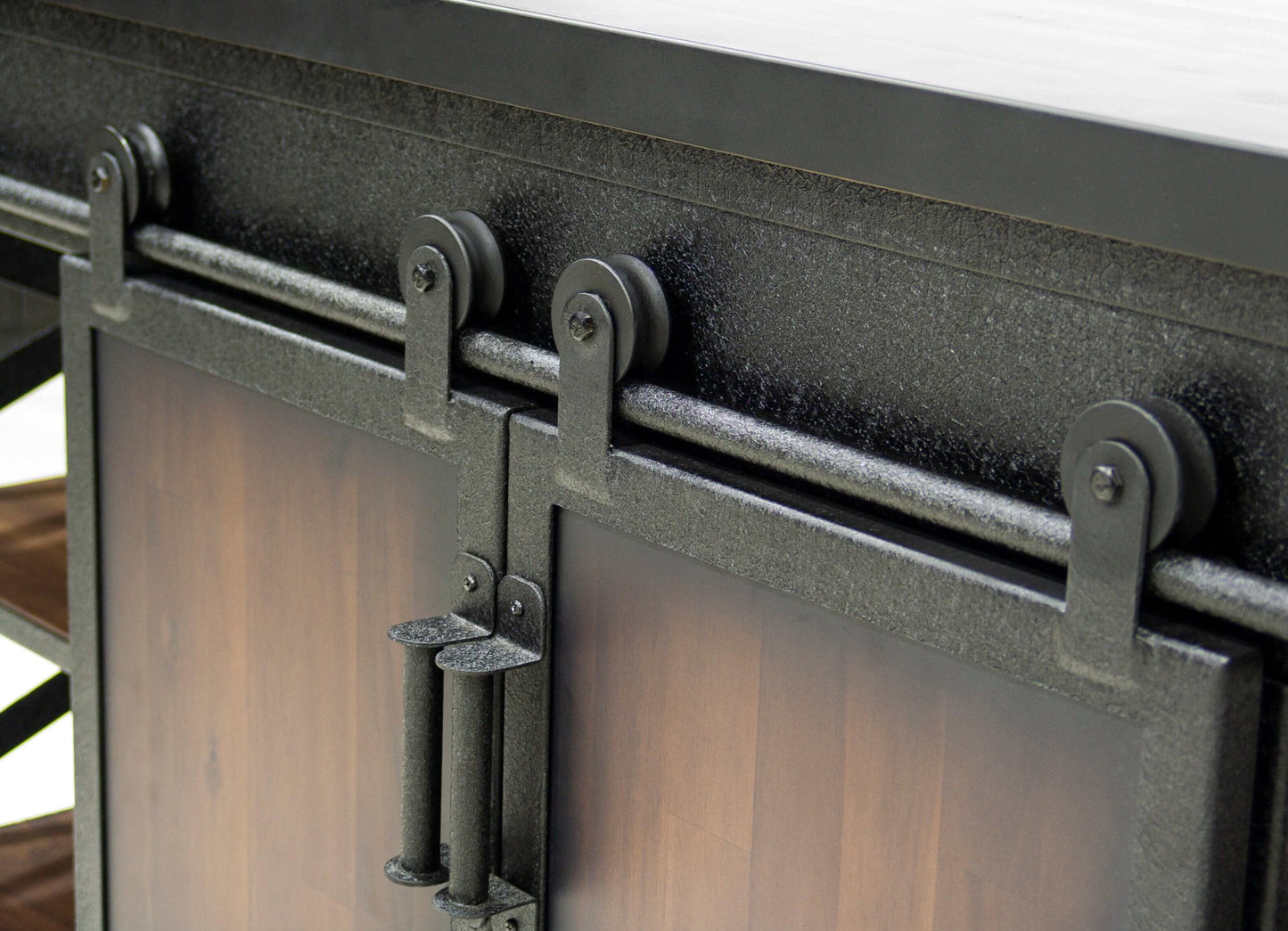 Close-up of the sliding door mechanism on the Duramax Farmhouse Cabinet 68062, showcasing its durable industrial design.