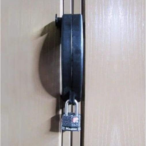 Duramax Heavy Duty Security Padlock securing outdoor storage on wooden door.