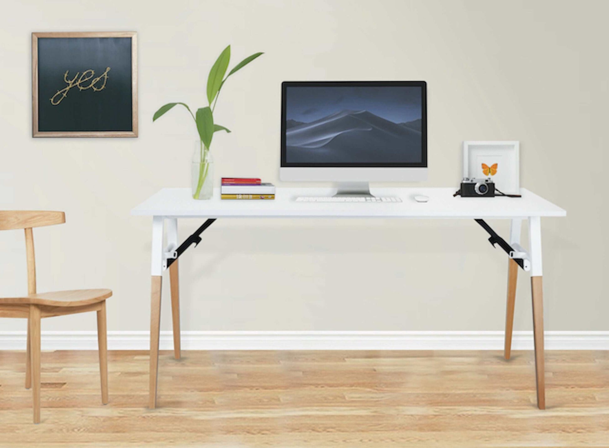 Modern Duramax Neo Folding Table 68053 in a minimalist workspace with computer and decor