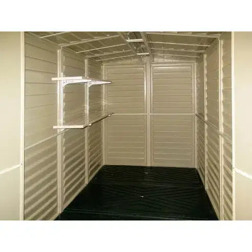 Interior of a shed featuring a Duramax Shed Shelf Kit with shelves for organized storage.