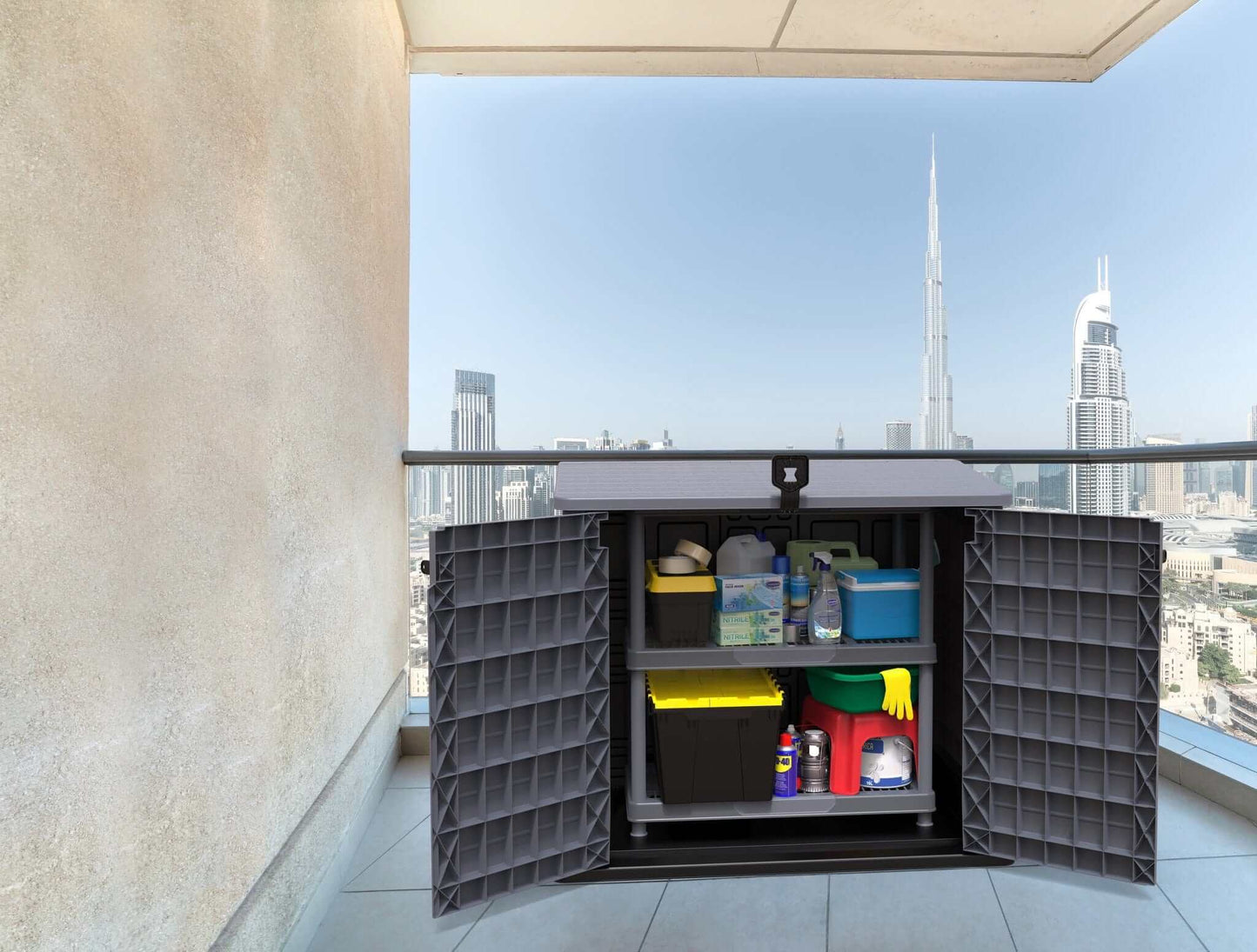 Duramax Storeaway 850L gray storage shed open on balcony, showcasing organized gardening tools and supplies.