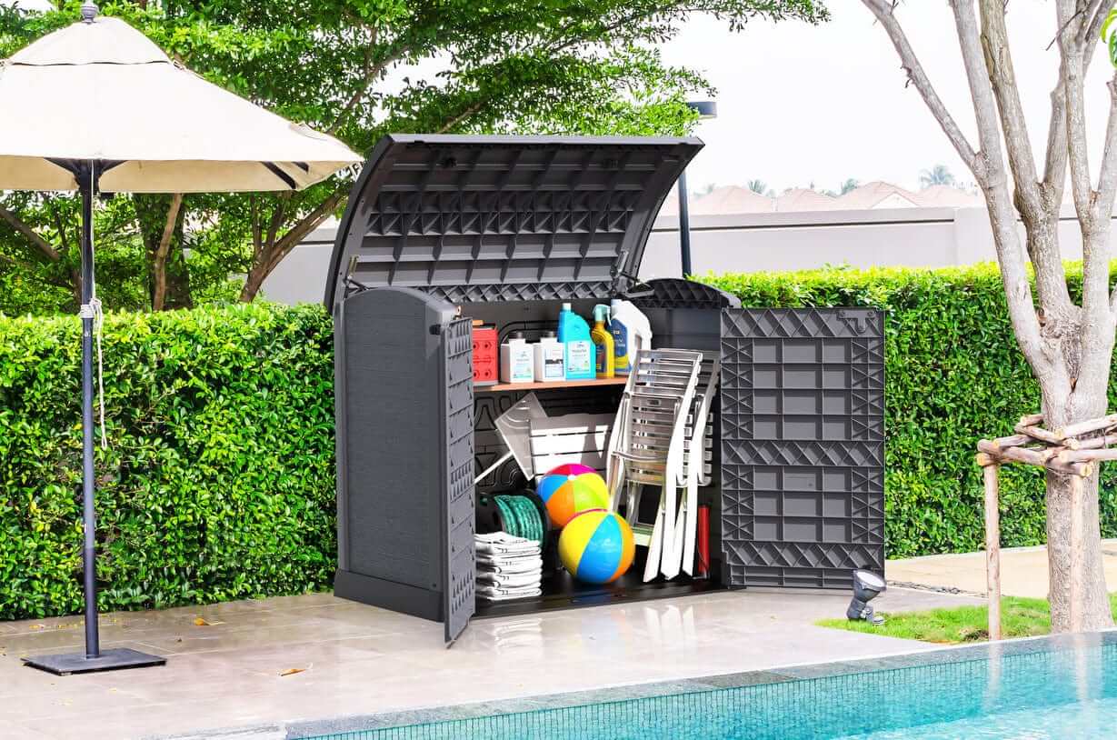 Duramax Storeaway Arc Lid 1200L Gray shed with garden tools and accessories stored neatly, enhancing outdoor organization.