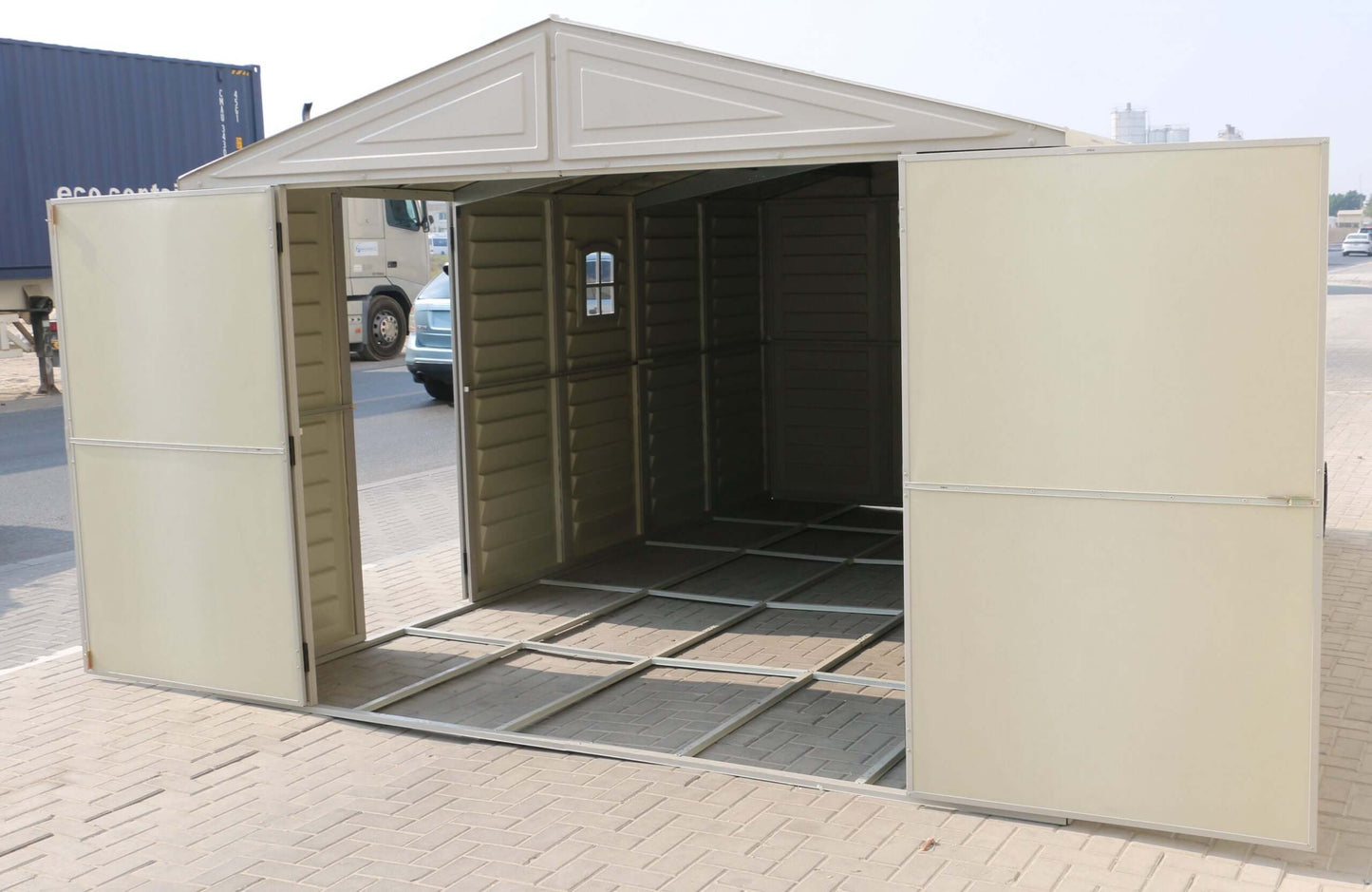 Duramax Vinyl Garage 10.5 x 15 w/ Foundation 15026, spacious storage structure with open doors.