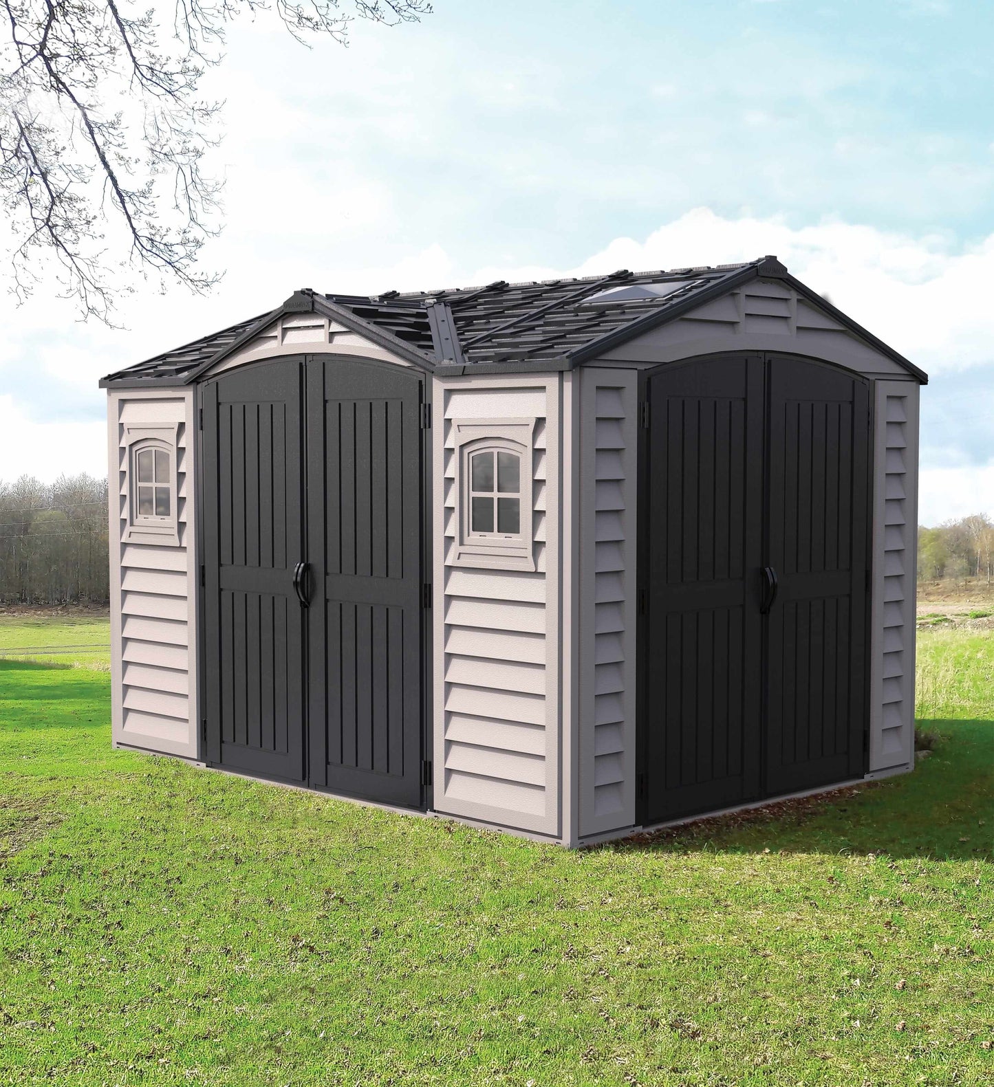 Duramax Vinyl Shed 10.5 x 8 Apex Pro with double doors on green lawn under blue sky.