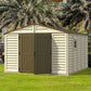 Duramax Vinyl Shed 10.5x13 Woodbridge Plus with foundation in a landscaped garden setting.