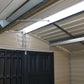 Interior view of a Duramax Vinyl Shed showcasing a sturdy roof and double door design.