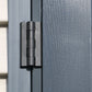 Close-up of a durable black hinge on a gray vinyl shed door.