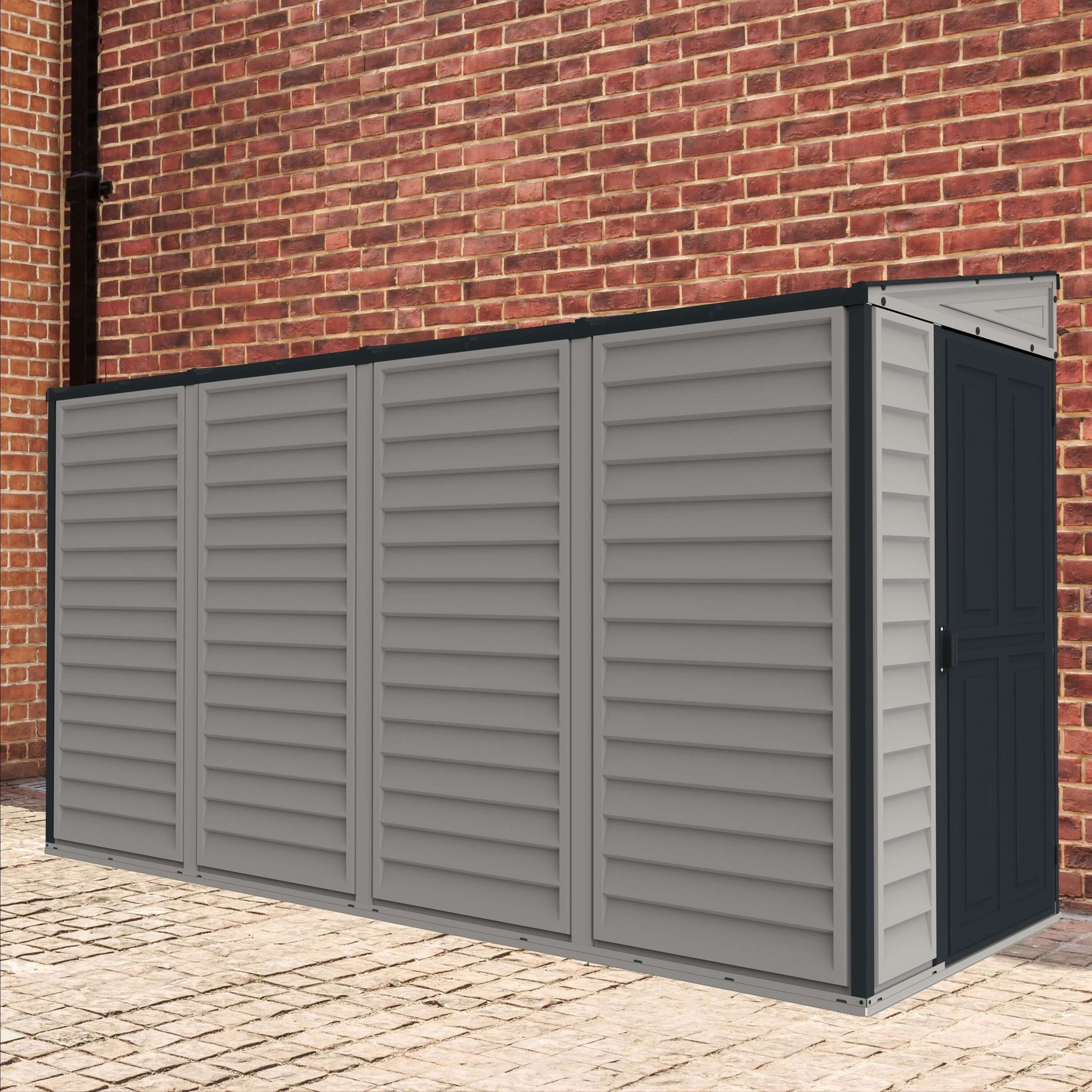 Duramax Vinyl Shed 4x10 SideMate Plus against a brick wall for outdoor storage and organization.