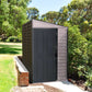 Duramax Vinyl Shed 4x8 SideMate Plus in gray, ideal outdoor storage solution next to garden.