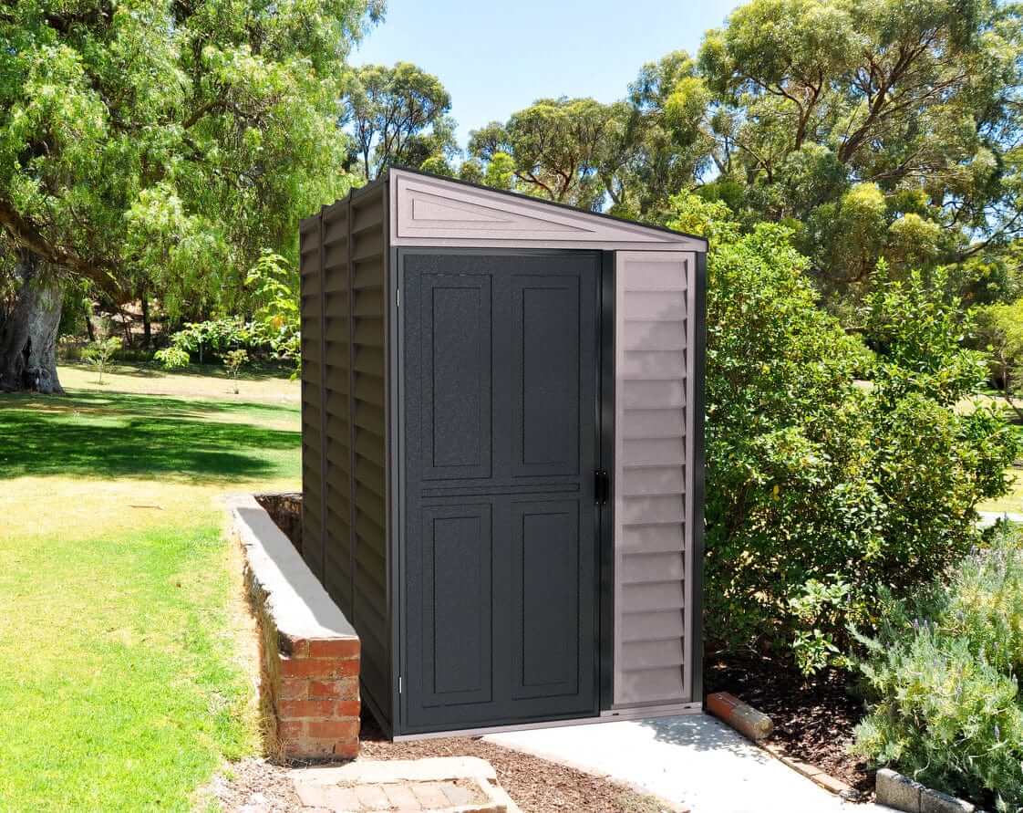 Duramax Vinyl Shed 4x8 SideMate Plus in gray, ideal outdoor storage solution next to garden.