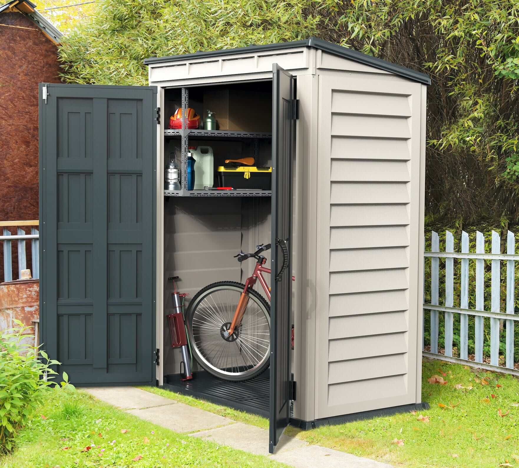 Duramax Vinyl Shed 5x3 YardMate with open doors, bike and storage inside, in a garden setting.